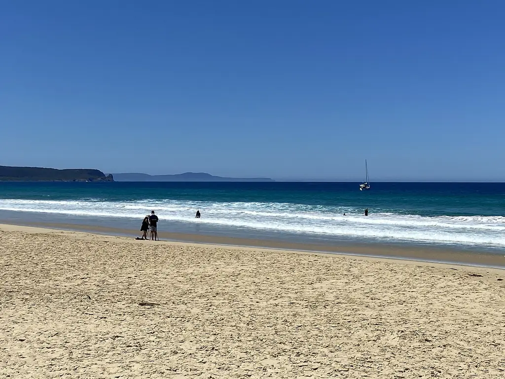 The curving beach and calm water of Adventure Bay, South Bruny