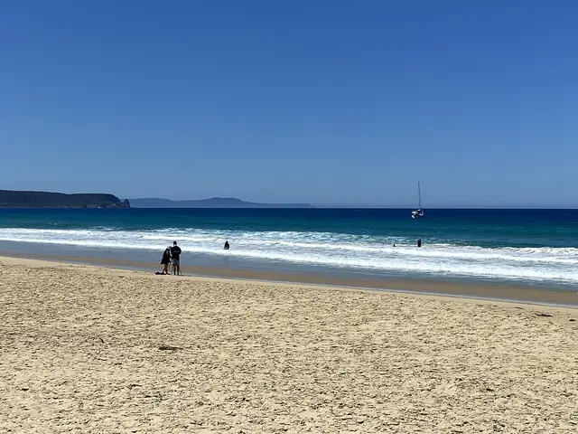 The curving beach and calm water of Adventure Bay, South Bruny