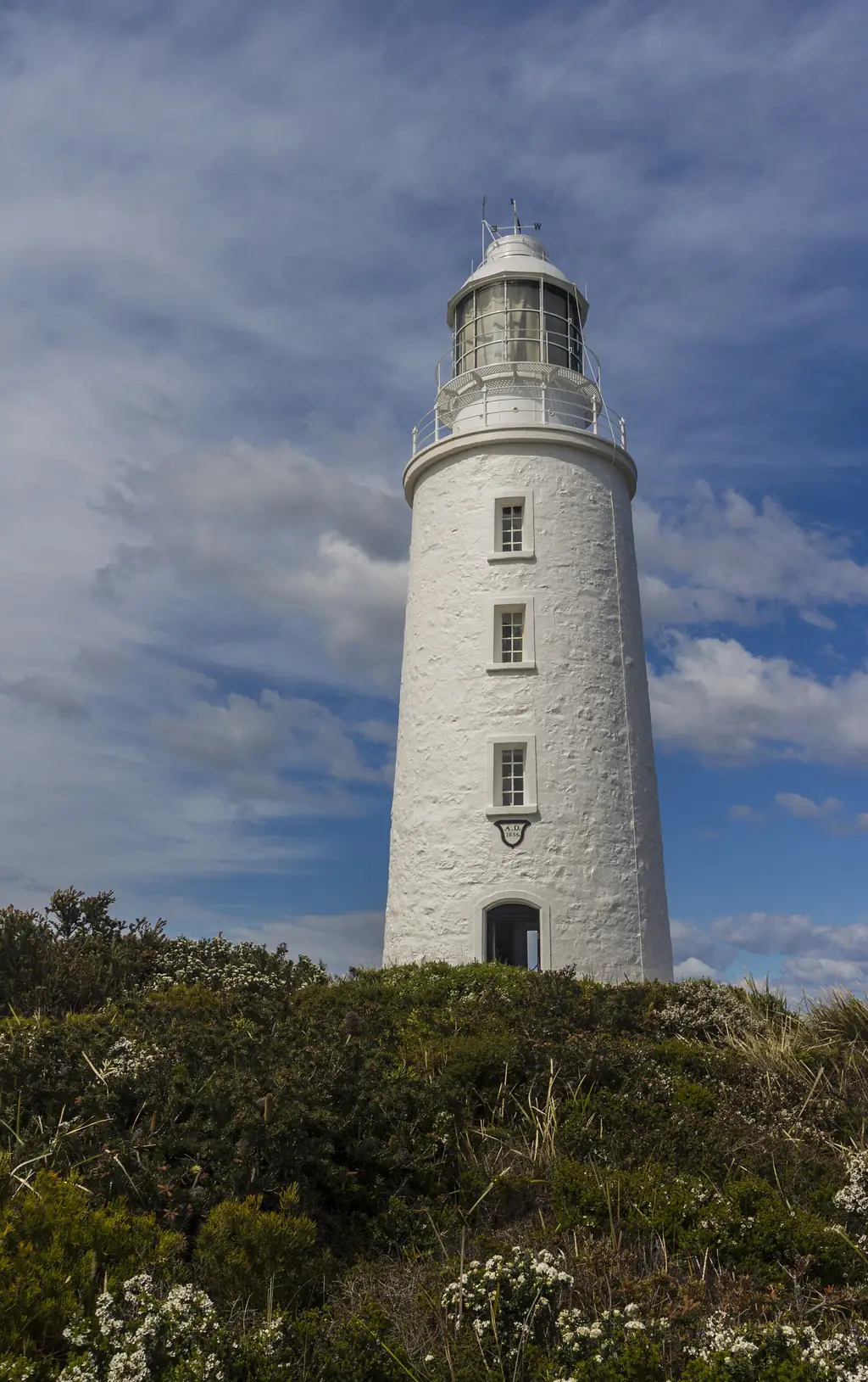 Cape Bruny Lighthouse, the white stone tower on the southern tip of Bruny Island
